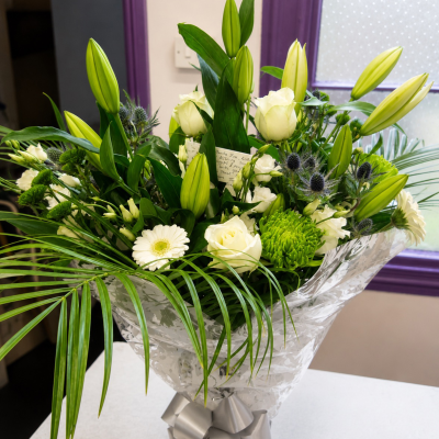 Pure Elegance - Bring some tranquillity into your home with this stunning selection of  white, cream and green flowers featuring lilies and roses.