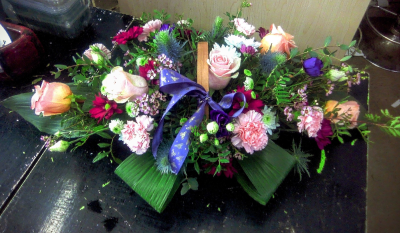 Meadow Basket - A charming basket arrangement bursting with a beautiful blend of soft blush, peach, purple, and rich berry tones. Handcrafted with lush greenery, delicate textures, and a coordinating ribbon detail, this design has a relaxed, garden-inspired feel. Perfect for birthdays, thank-you gifts, celebrations, or simply brightening someone’s day with a thoughtful and colourful surprise.